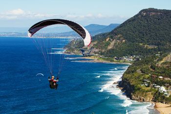 Paraglider floats over Madeira